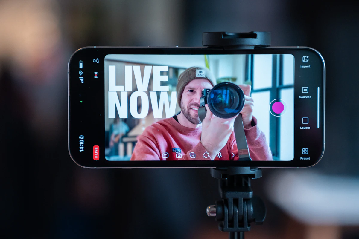 online-video-marketing Business owner recording a marketing video with a smartphone on a tripod