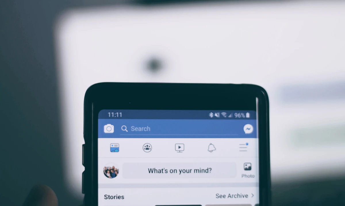 Person using a Facebook business page on a smartphone
